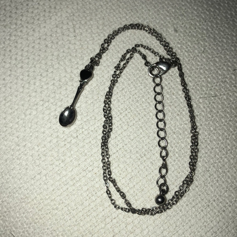 Adorable spoon necklace with navy blue accent.